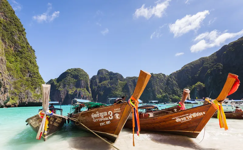 Longtail boats on a turquoise beach, Phi Phi Islands