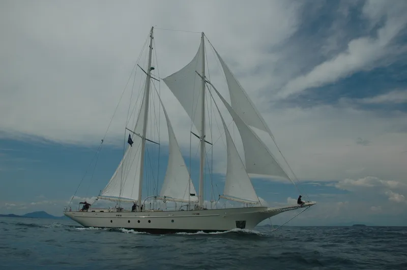 Tall sailing yacht under full sail on the open sea